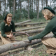 Land Army girls sawing larch poles for use as pit props at the Women’s Timber Corps training camp at Culford, Suffolk, 1943. (Imperial War Museum)